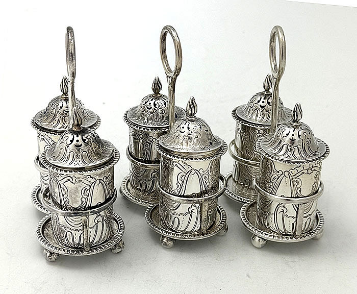 three matching salt and pepper cruet sets English antique silver